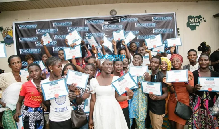 SOCASEMP 3.0 graduates holding up their certificates at the Makoko exhibition