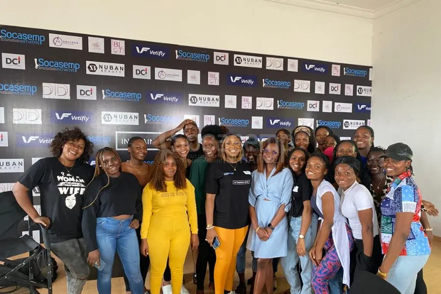 Participants of the SOCASEMP ITW Tola Banks masterclass gathered together in front of the sponsors backdrop